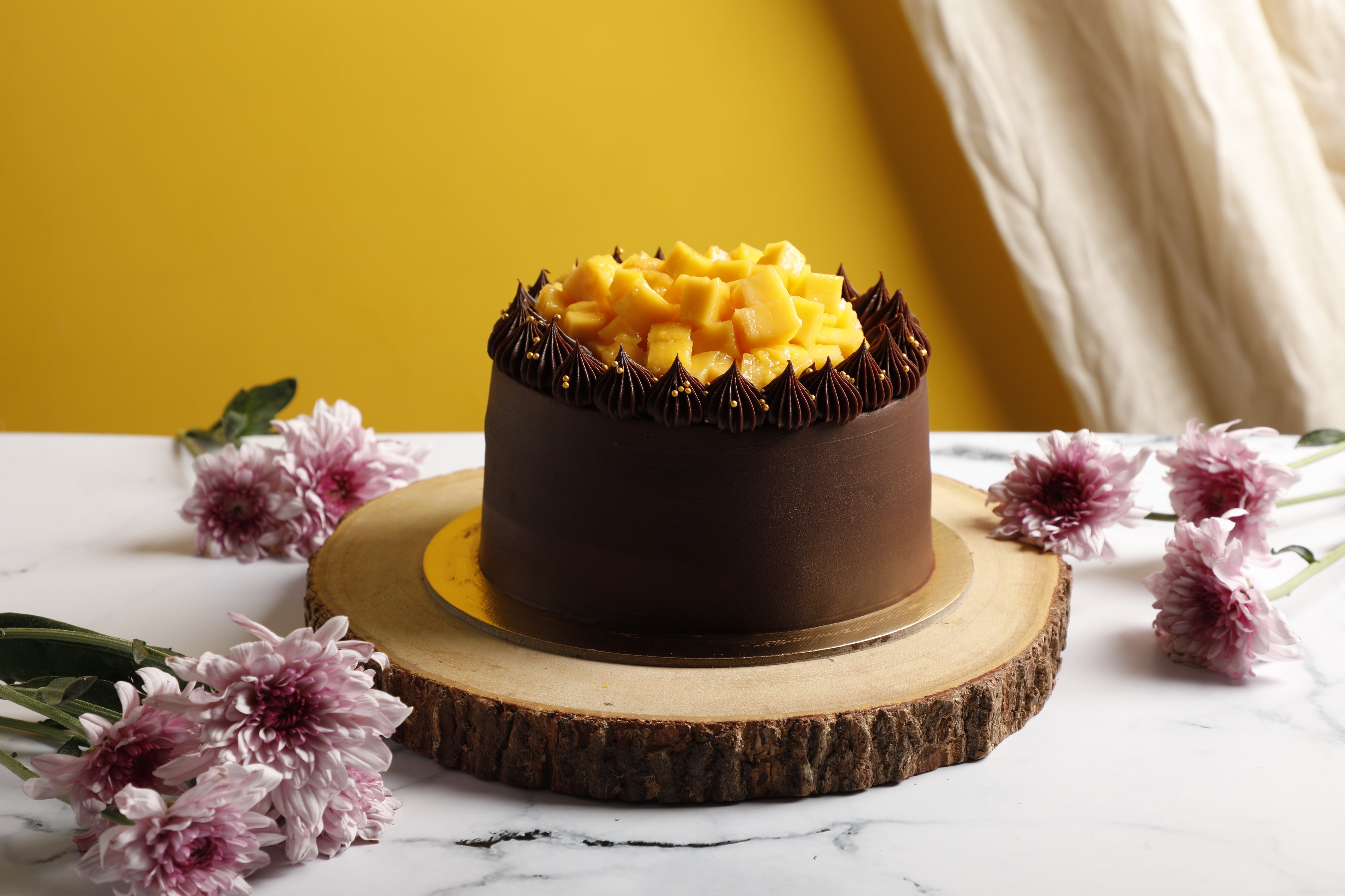 Mango Cake with Chocolate Sauce and Cream | Tin and Thyme